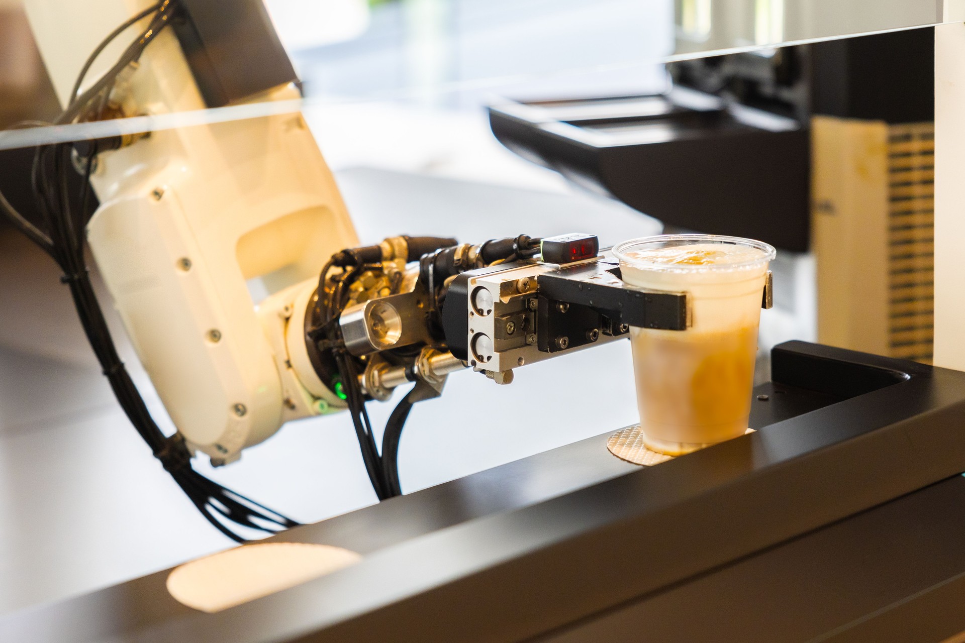 Robot arm with 3D camera serving iced coffee